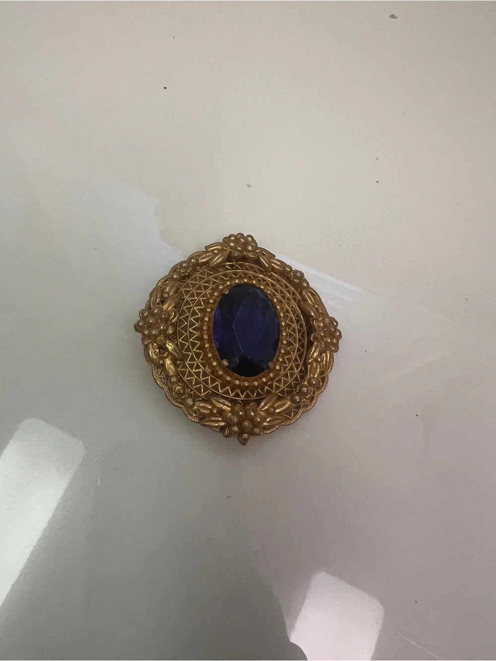 Vintage Gold Tone Brooch with Deep Blue Center Stone